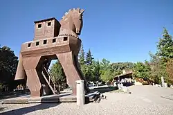Wooden Trojan Horse monument in the plaza before the modern gate to the ancient city