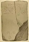 1856 drawing of the symbols on the stone. To the left is a double disc with Z-rod, to the right a fish monster and a sword. The head with antennae is a 19th-century addition.
