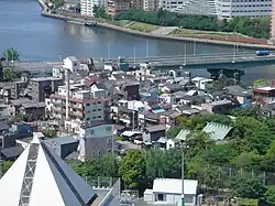 Tsukudajima, with its traditional buildings and the Tsukuda Bridge (Tsukuda Ohashi).