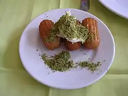 Tulumba with kaymak and pistachio