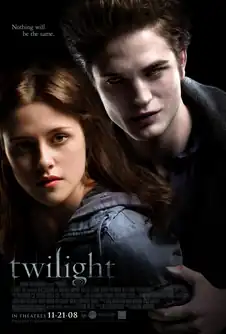 A pale young man fills the top right of the poster, hovering over a brown-haired young woman on the left, with the word "twilight" on the lower left.