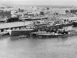 USS Holland (AS-3) tending submarines at Fremantle submarine base, Australia, on 5 March 1942