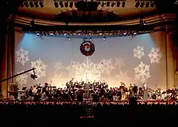 The United States Navy Band Concert Band performs traditional and popular holiday music for the television special, "Happy Holidays" at DAR Constitution Hall in Washington, D.C., 2001.