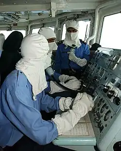 Pakistan Navy's sailors wearing anti-flash gear while operating a Guided missile frigate, PNS Alamgir