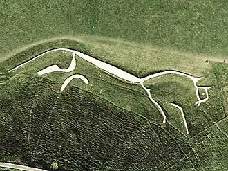 A Bronze Age hill figure of a running horse.