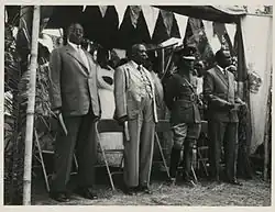 Four kings of Ugandan kingdoms, from left to right: The Omugabe of Ankole, Omukama of Bunyoro, the Kabaka of Buganda, and the Won Nyaci of Lango, at the signing of an agreement in Kabarole, Toro, Uganda, between the British governor, Sir Frederick Crawford and the Omukama of Toro.