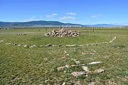 A Khirigsuur, with central mound of circular stone enclosure, near Mörön, Northern Mongolia