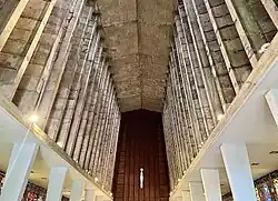 Vaulted concrete ceiling.
