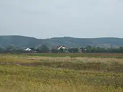 Commune with mountains behind it