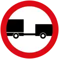 No entry for any power driven vehicle drawing a trailer, except semi-trailers or single axle trailers