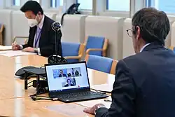 an image of an ongoing virtual meeting as a medium of interaction in a virtual community