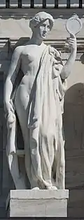 Marble statue of a woman holding a mirror