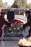 President Vladimir Putin laying a wreath at the memorial.