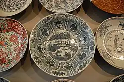 Detail. The "sketchy" dish at lower right has a main human figure.