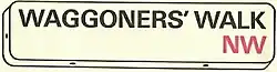 A drawing of a standard London street sign, showing the name Waggoners' Walk in black and the postal area NW in red.