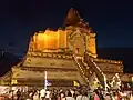 Wat Chedi Luang lit at night during Tam Bun Khan Dok