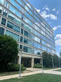 The south face of Waterfront Tower, featuring large glass windows and concrete columns.