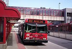 Red bus at a station