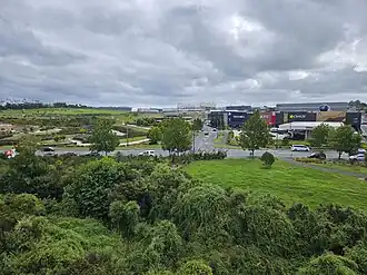 Commercial buildings and Kopupaka Reserve in Westgate