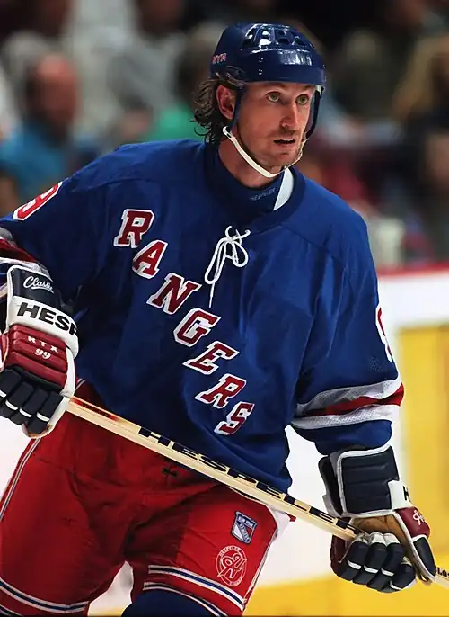 Image 3 Wayne Gretzky Photo credit: Håkan Dahlström Ice hockey player Wayne Gretzky, as a member of the New York Rangers of the National Hockey League (NHL) in 1997. Gretzky, nicknamed "The Great One", is widely considered the best hockey player of all time. Upon his retirement in 1999, he held forty regular-season records, fifteen playoff records, and six All-Star records. He is the only NHL player to total over 200 points in one season—a feat he accomplished four times. In addition, he tallied over 100 points in 15 NHL seasons, 13 of them consecutively. He is the only player to have his number (99) officially retired by the NHL for all teams. More selected pictures