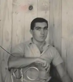 Artist seated in his studio