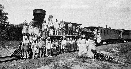 Postcard photo of the William Crooks with members of the Blackfoot tribe. The photo was taken at the Fair of the Iron Horse in Baltimore, MD, in 1927.