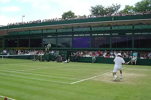 Image 19Sébastien Grosjean takes a shot on Court 18 during the 2004 Championships. (from Wimbledon Championships)