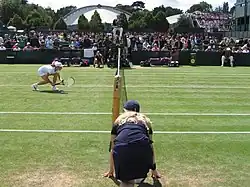 Image 63Wimbledon ball girl at the net, in the 2007 edition (from Wimbledon Championships)