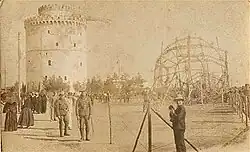 B&W photo of wreckage next to w round castle