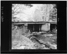 Northern sluice gate and crib structure from below the dam, north bank
